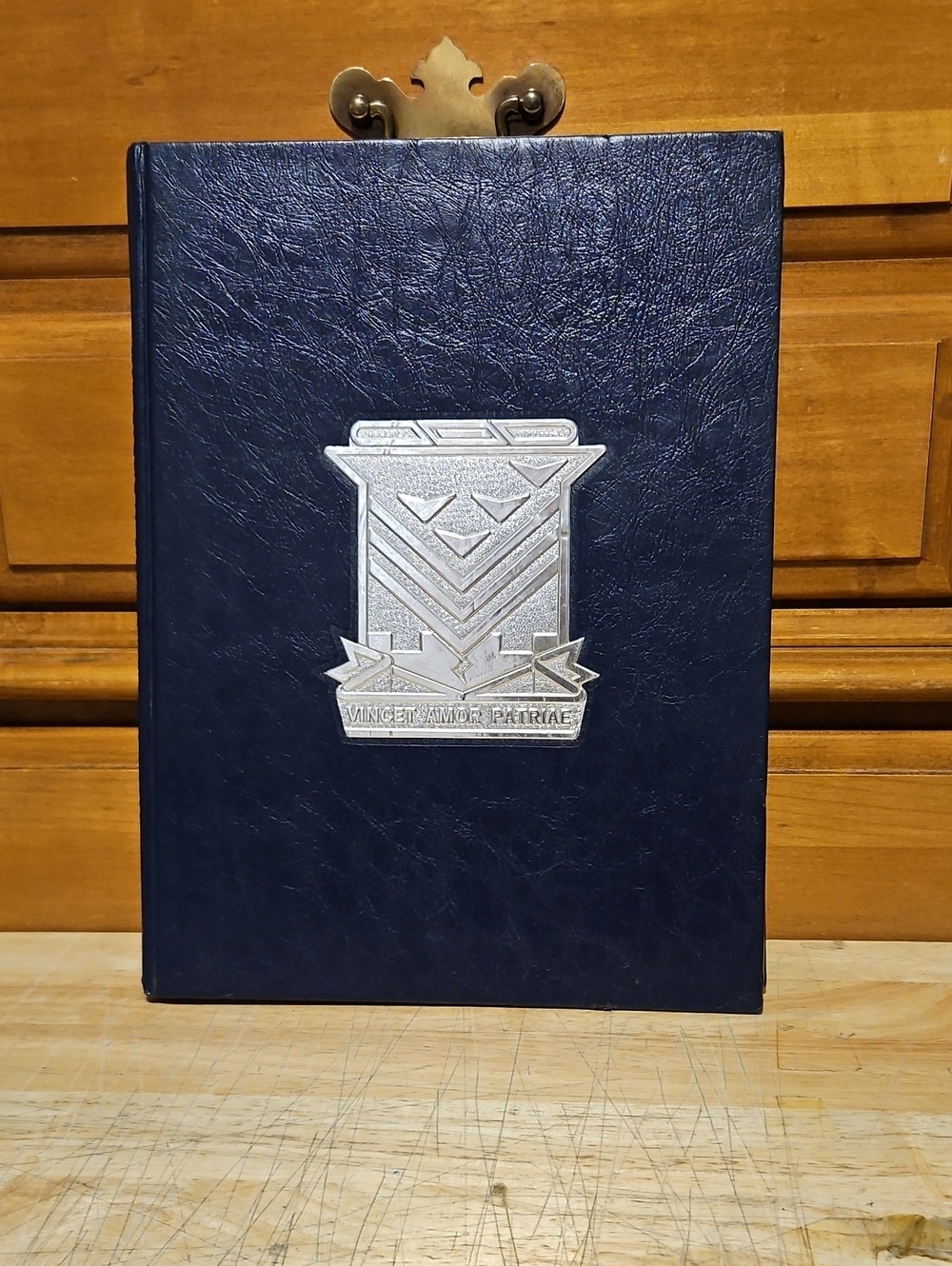 Decorative Navy Leatherette Book Accent with Silver Emblem